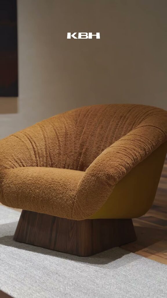 Still from the KBH film: A corner lit by ginger-yellow shearling