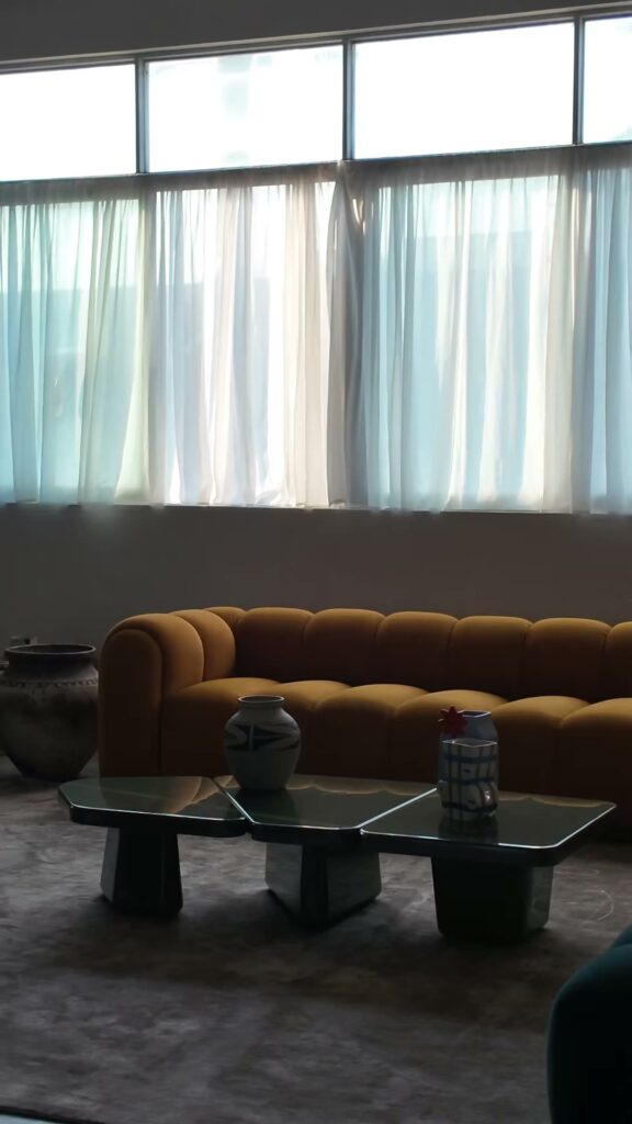 Still from the KBH film: A warm-yellow sofa for the living room