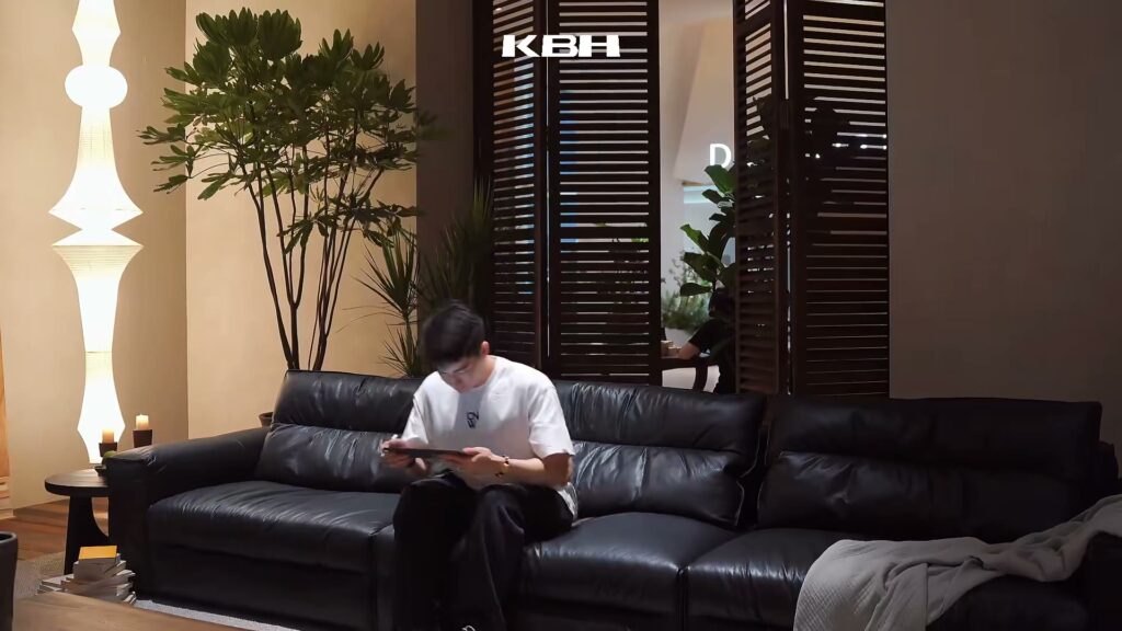 Still from the KBH film: Black leather sofa — the home-office pod