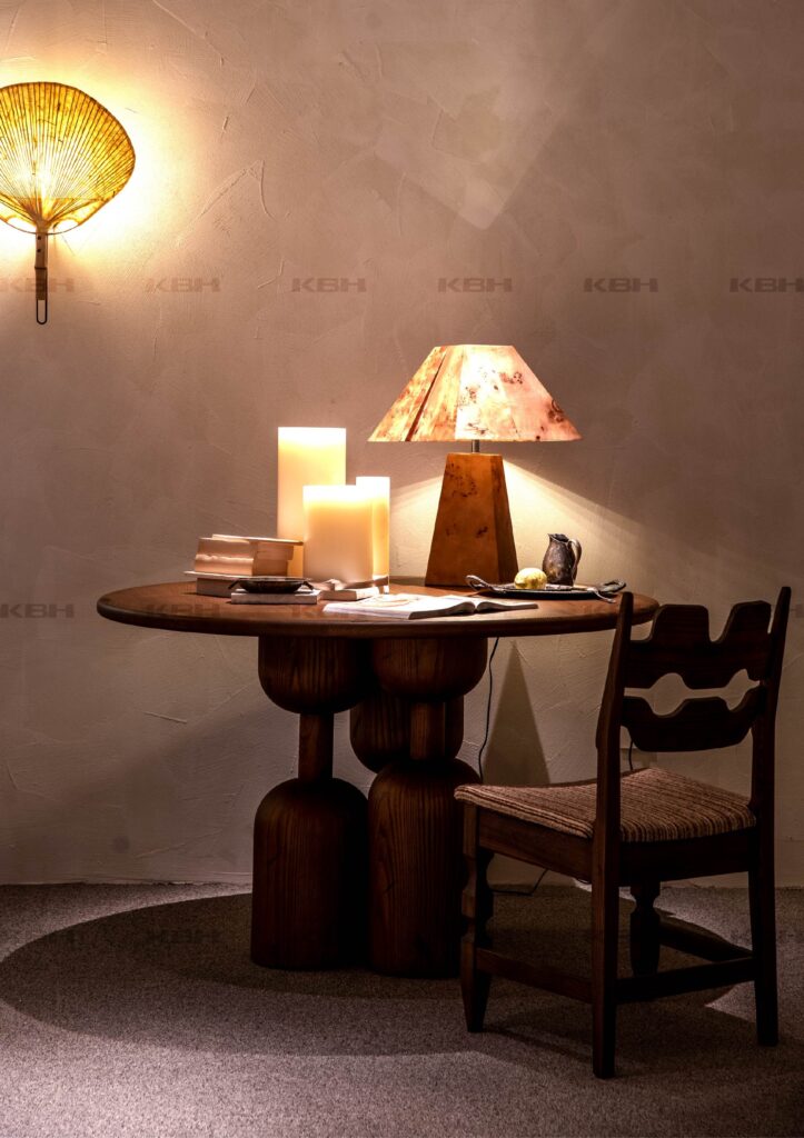 KBH Hourglass Round Table in a dining room setting, view 2