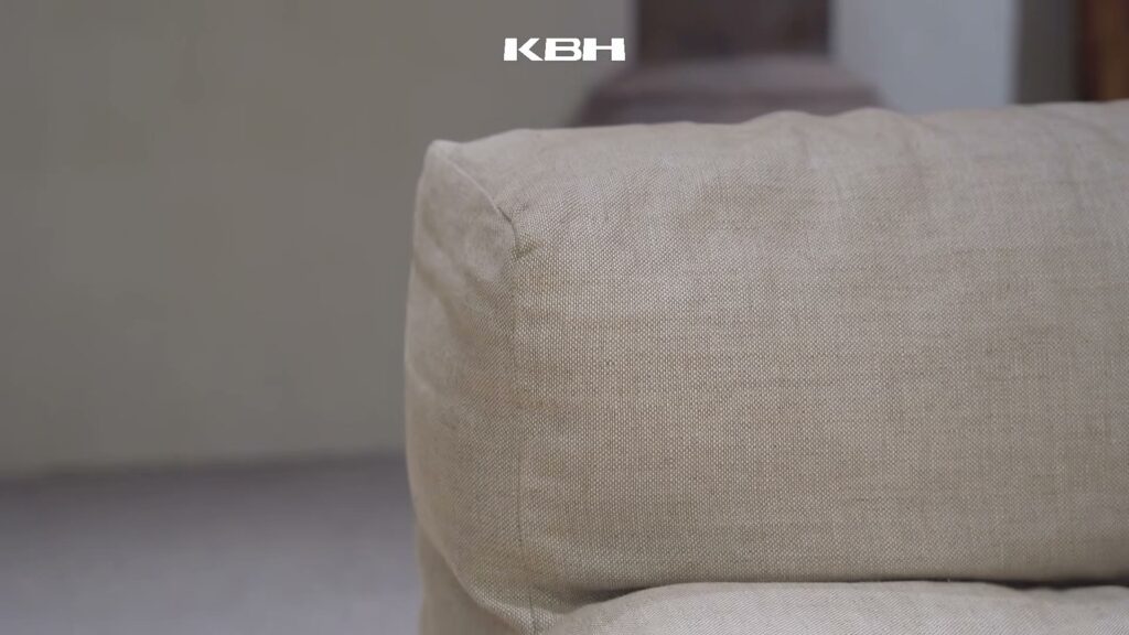 Still from the KBH film: White linen sofa — ease in one move